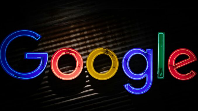 Google announces restructuring to accelerate AI initiatives Google logo neon sign as the company announces a restructuring of its divisions and leadership to accelerate its AI initiatives.