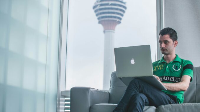 Understanding AI's impact on the workforce Man working on a computer illustrating a report from the Tony Blair Institute highlighting AI's potential impact on the workforce, including the opportunities and risks to the labor market and how government and policymakers can mitigate the challenges.