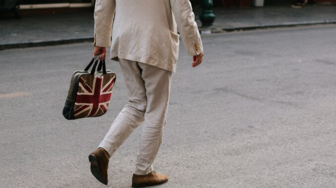 UK Government signs off sweeping AI action plan Photo of a man carrying a bag with the Union Jack flag of the UK as Prime Minister Keir Starmer unveils an AI action plan aiming to harness artificial intelligence technologies to unlock economic potential, transform public services such as the NHS, and more.