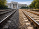 Rail lines leading directly to the Federal Reserve, symbolizing FedNow advancing into payment infrastructure long associated with XRP’s core use case